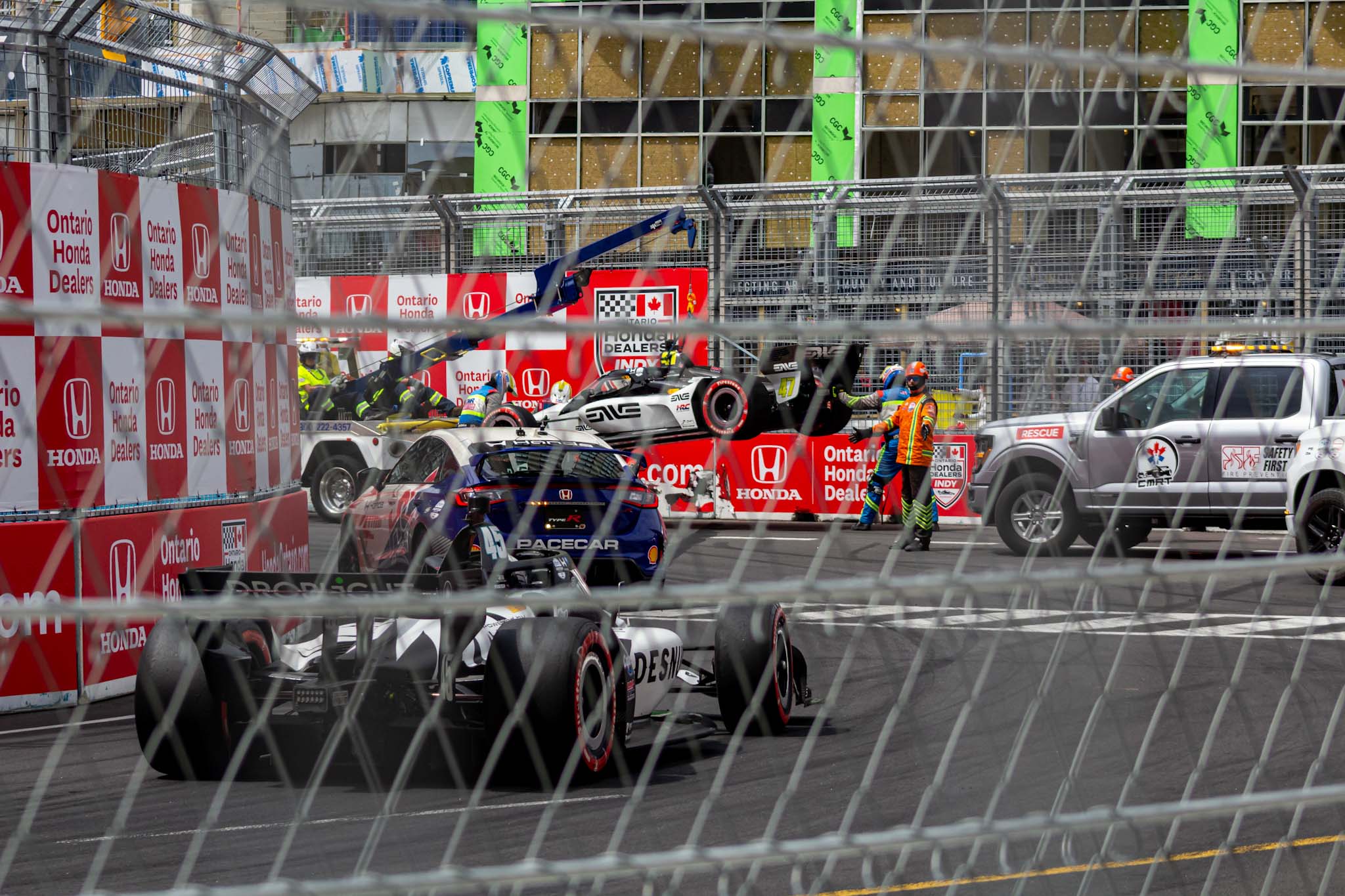 A tow truck recovers Mick Schumacher's vehicle after a race ending crash